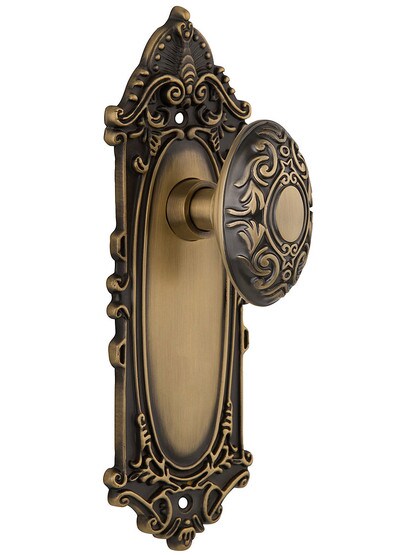 Largo Design Door Set With Decorative Oval Door Knobs Single Dummy in Antique Brass.